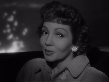 Movie still from “Since You Went Away” (1944), directed by John Cromwell – An old photo of a woman in a car; Close Up shot, Low angle