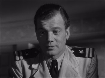 Movie still from “Since You Went Away” (1944), directed by John Cromwell – A black and white photo of a man in a uniform; Close Up shot, Low angle