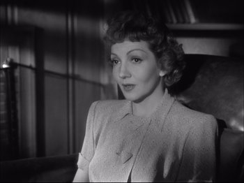 Movie still from “Since You Went Away” (1944), directed by John Cromwell – An old black and white photo of a woman; Close Up shot, High angle