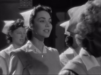 Movie still from “Since You Went Away” (1944), directed by John Cromwell – An old black and white photo of a woman talking to another woman; Close Up shot, Low angle