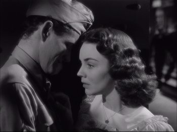 Movie still from “Since You Went Away” (1944), directed by John Cromwell – A man and a woman looking at one another; Close Up shot, Low angle