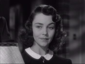 Movie still from “Since You Went Away” (1944), directed by John Cromwell – A black - and - white photo of a young woman; Close Up shot, High angle