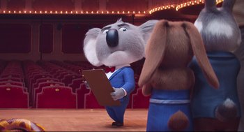 Movie still from “Sing” (2016), directed by Christophe Lourdelet – A dog and a koala are standing in front of a stage; Wide shot, Low angle