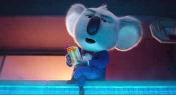 Movie still from “Sing” (2016), directed by Christophe Lourdelet – A koala holding a soda in his hand; Medium shot, Low angle