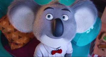 Movie still from “Sing” (2016), directed by Christophe Lourdelet – The head and face of a stuffed animal koala; Close Up shot, Low angle