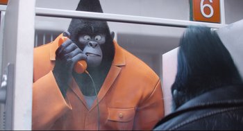 Movie still from “Sing” (2016), directed by Christophe Lourdelet – A man that is talking on the phone; Close Up shot, Over the shoulder angle