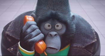 Movie still from “Sing” (2016), directed by Christophe Lourdelet – An animated gorilla holding a phone up to his ear; Close Up shot, High angle