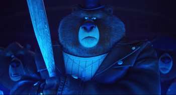 Movie still from “Sing” (2016), directed by Christophe Lourdelet – A bear wearing a top hat and holding a baseball bat; Medium shot, Low angle