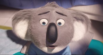 Movie still from “Sing” (2016), directed by Christophe Lourdelet – The head of a stuffed animal koala; Close Up shot, Low angle