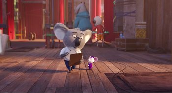 Movie still from “Sing” (2016), directed by Christophe Lourdelet – A mouse and a rat are standing on a wooden floor; Wide shot, Over the shoulder angle