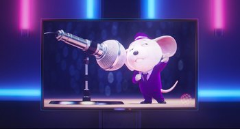 Movie still from “Sing” (2016), directed by Christophe Lourdelet – A mouse is holding a microphone up to a microphone stand; Medium shot, Low angle