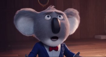 Movie still from “Sing” (2016), directed by Christophe Lourdelet – A cartoon koala with a surprised look; Close Up shot, Low angle