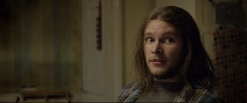 Movie still from “Sing Street” (2016), directed by John Carney – A person with long brown hair; Close Up shot, Over the shoulder angle