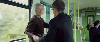 Movie still from “Sing Street” (2016), directed by John Carney – A woman and a young man on a bus; Medium shot, Over the shoulder angle