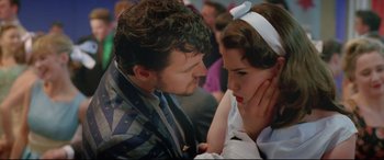 Movie still from “Sing Street” (2016), directed by John Carney – A man and a woman looking at one another; Close Up shot, Over the shoulder angle