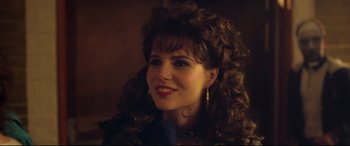 Movie still from “Sing Street” (2016), directed by John Carney – A person with long curly hair; Close Up shot, Over the shoulder angle