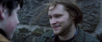 Movie still from “Sing Street” (2016), directed by John Carney – A person with long hair; Close Up shot, Over the shoulder angle