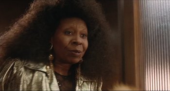 Movie still from “Sister Act” (1992), directed by Emile Ardolino – An older black woman wearing a gold jacket; Close Up shot, Low angle