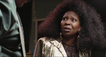 Movie still from “Sister Act” (1992), directed by Emile Ardolino – An older woman with big hair looking up at the sky; Close Up shot, Over the shoulder angle