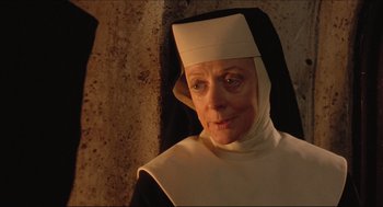 Movie still from “Sister Act” (1992), directed by Emile Ardolino – An older woman wearing a nun's outfit; Close Up shot, High angle