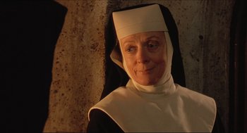 Movie still from “Sister Act” (1992), directed by Emile Ardolino – An older woman wearing a nun's outfit; Close Up shot, Low angle