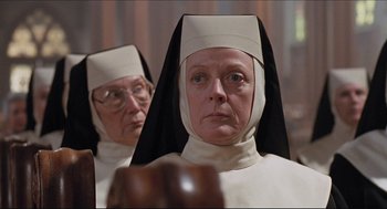 Movie still from “Sister Act” (1992), directed by Emile Ardolino – Two women dressed as nuns looking at each other; Close Up shot, Low angle