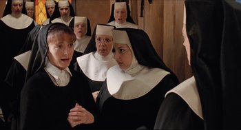 Movie still from “Sister Act” (1992), directed by Emile Ardolino – A group of women dressed in nun's clothes; Medium shot, High angle