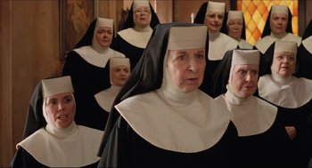 Movie still from “Sister Act” (1992), directed by Emile Ardolino – A group of nuns standing next to each other; Medium shot, High angle