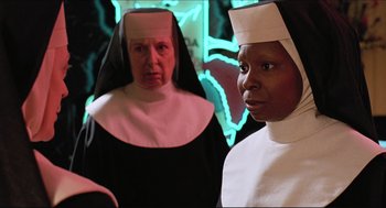 Movie still from “Sister Act” (1992), directed by Emile Ardolino – Two women dressed as nuns standing next to each other in front of a neon sign; Close Up shot, Low angle