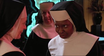 Movie still from “Sister Act” (1992), directed by Emile Ardolino – A nun and another nun are dressed up for a costume party; Close Up shot, Low angle