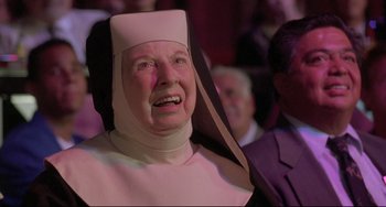 Movie still from “Sister Act 2: Back in the Habit” (1993), directed by Bill Duke – An older woman in a nun's outfit is laughing; Close Up shot, Low angle