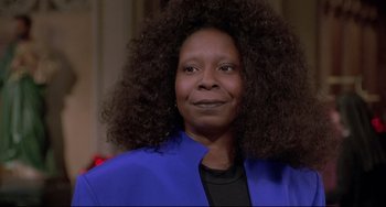 Movie still from “Sister Act 2: Back in the Habit” (1993), directed by Bill Duke – An older woman with long black hair wearing a blue jacket; Close Up shot, Low angle