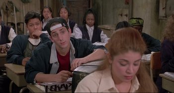 Movie still from “Sister Act 2: Back in the Habit” (1993), directed by Bill Duke – A group of people sitting in a room; Medium shot, Over the shoulder angle