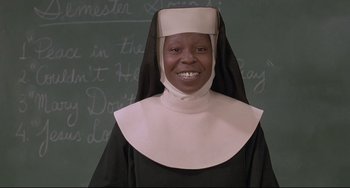 Movie still from “Sister Act 2: Back in the Habit” (1993), directed by Bill Duke – A woman in a nun's outfit smiling for the camera; Close Up shot, Low angle