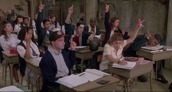 Movie still from “Sister Act 2: Back in the Habit” (1993), directed by Bill Duke – A group of people sitting at a desk in a classroom; Medium shot, High angle