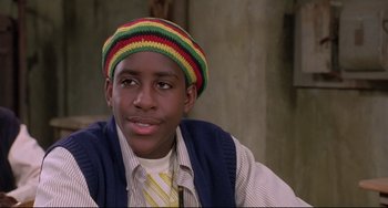 Movie still from “Sister Act 2: Back in the Habit” (1993), directed by Bill Duke – A young man wearing a hat and a tie; Close Up shot, Low angle