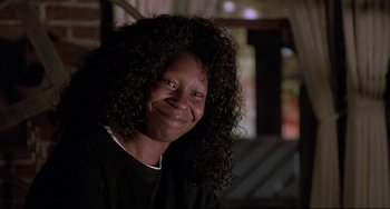 Movie still from “Sister Act 2: Back in the Habit” (1993), directed by Bill Duke – A person with curly hair smiling; Close Up shot, Low angle