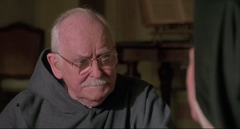 Movie still from “Sister Act 2: Back in the Habit” (1993), directed by Bill Duke – An older man with glasses and a mustache; Close Up shot, High angle
