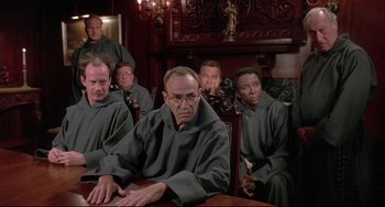Movie still from “Sister Act 2: Back in the Habit” (1993), directed by Bill Duke – A group of men sitting in a courtroom; Medium shot, High angle