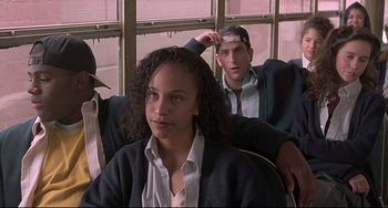 Movie still from “Sister Act 2: Back in the Habit” (1993), directed by Bill Duke – A group of young people sitting on a bench; Medium shot, High angle