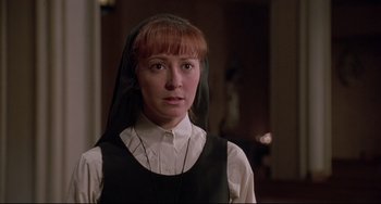 Movie still from “Sister Act 2: Back in the Habit” (1993), directed by Bill Duke – A woman in a nun's outfit looking at the camera; Close Up shot, Low angle