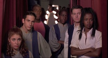 Movie still from “Sister Act 2: Back in the Habit” (1993), directed by Bill Duke – A group of young men standing next to each other; Medium shot, High angle