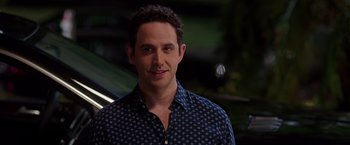 Movie still from “Sisters” (2015), directed by Jason Moore – A person wearing a blue shirt; Close Up shot, Over the shoulder angle