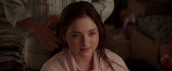 Movie still from “Sisters” (2015), directed by Jason Moore – A young woman getting her hair combed by a stylist; Close Up shot, Over the shoulder angle