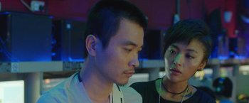 A man and a woman looking at one another