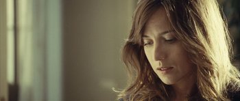 Movie still from “Sleep Tight” (2011), directed by Jaume Balagueró – A person with long hair; Close Up shot, Low angle