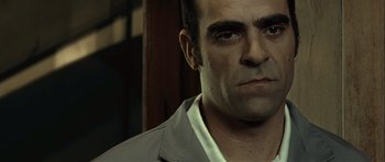 Movie still from “Sleep Tight” (2011), directed by Jaume Balagueró – A person wearing a jacket; Close Up shot, Low angle