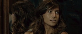 Movie still from “Sleep Tight” (2011), directed by Jaume Balagueró – A person with long brown hair; Close Up shot, Over the shoulder angle