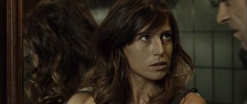 Movie still from “Sleep Tight” (2011), directed by Jaume Balagueró – A person with long brown hair; Close Up shot, Over the shoulder angle