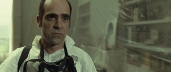 Movie still from “Sleep Tight” (2011), directed by Jaume Balagueró – A man wearing a white shirt and tie; Close Up shot, Low angle